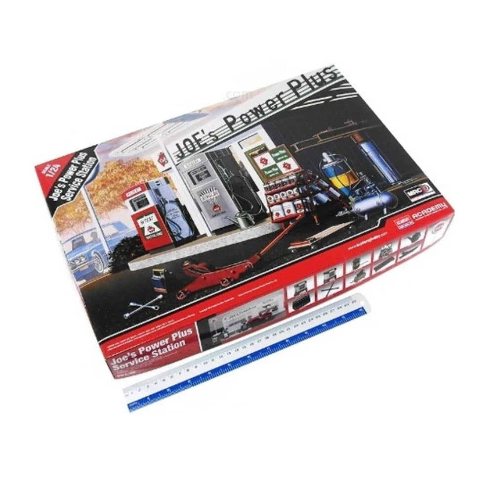 1:24 scale plastic model kit of Joe's Power Plus Service Station with detailed gas pumps and workshop equipment