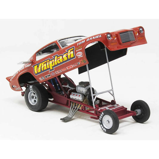 1/32 scale Whiplash Funny Car model kit in red, featuring detailed engine and open body design by Atlantis Models.