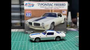 1/32 scale 1971 Pontiac Firebird Trans Am model kit by Atlantis, featuring white body with blue stripes on a green work surf